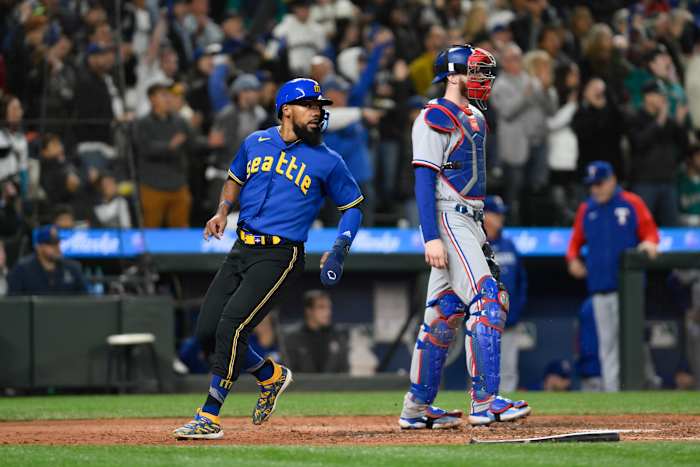 Sep 29, 2023; Seattle, Washington, USA; Seattle Mariners right fielder Teoscar Hernandez (35) scores a run against the Texas Rangers during the fourth inning at T-Mobile Park. Mandatory Credit: Steven Bisig-USA TODAY Sports
